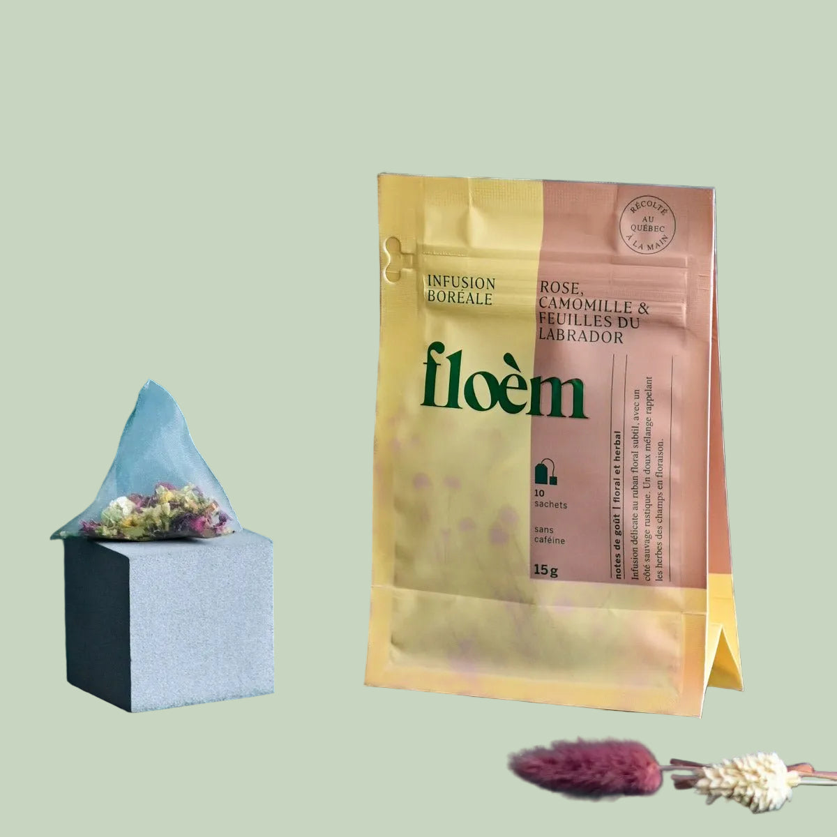 Floem Rose, Camomile & Labrador Leaves boreal herbal tea bag and package with dried flowers on a sage green background — Sensory for Calm