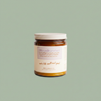 Misiyo Lavender Unwind candle amber jar with white lid on sage background — glass candle — Sensory for Calm