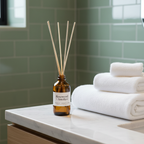 Misiyo Rosewood and Amethyst reed diffuser on bathroom shelf beside folded white towels — home fragrance — Sensory for Calm